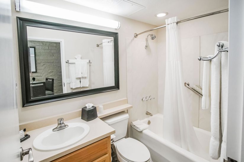 Photo of bathroom with a bath tub and white towels