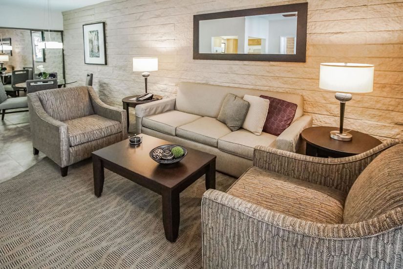 Photo of unit sitting area showcasing three couches