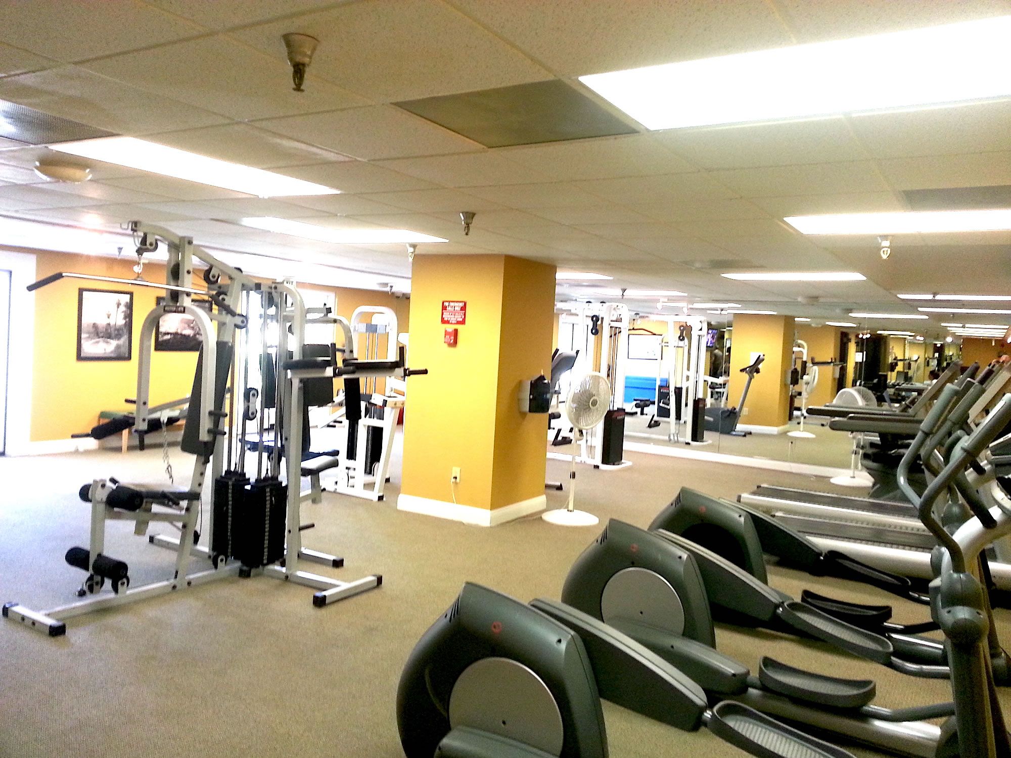 A well-equipped gym with various exercise machines and equipment.