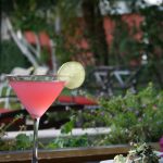 Photo of a red Cocktail with a lime
